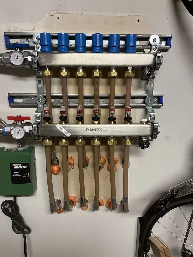 Plumber performing Water Heater Repair at a residential property in East Brunswick